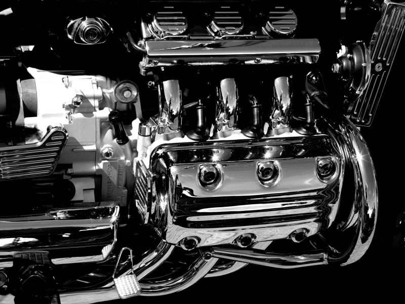 A closeup shot of motorcycle engine in dark background